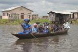 CRW_4551 Oct. 29, 2006 - Contonou, Benin - Stilt Village.  Dressed up and out for a ride with the kids.
